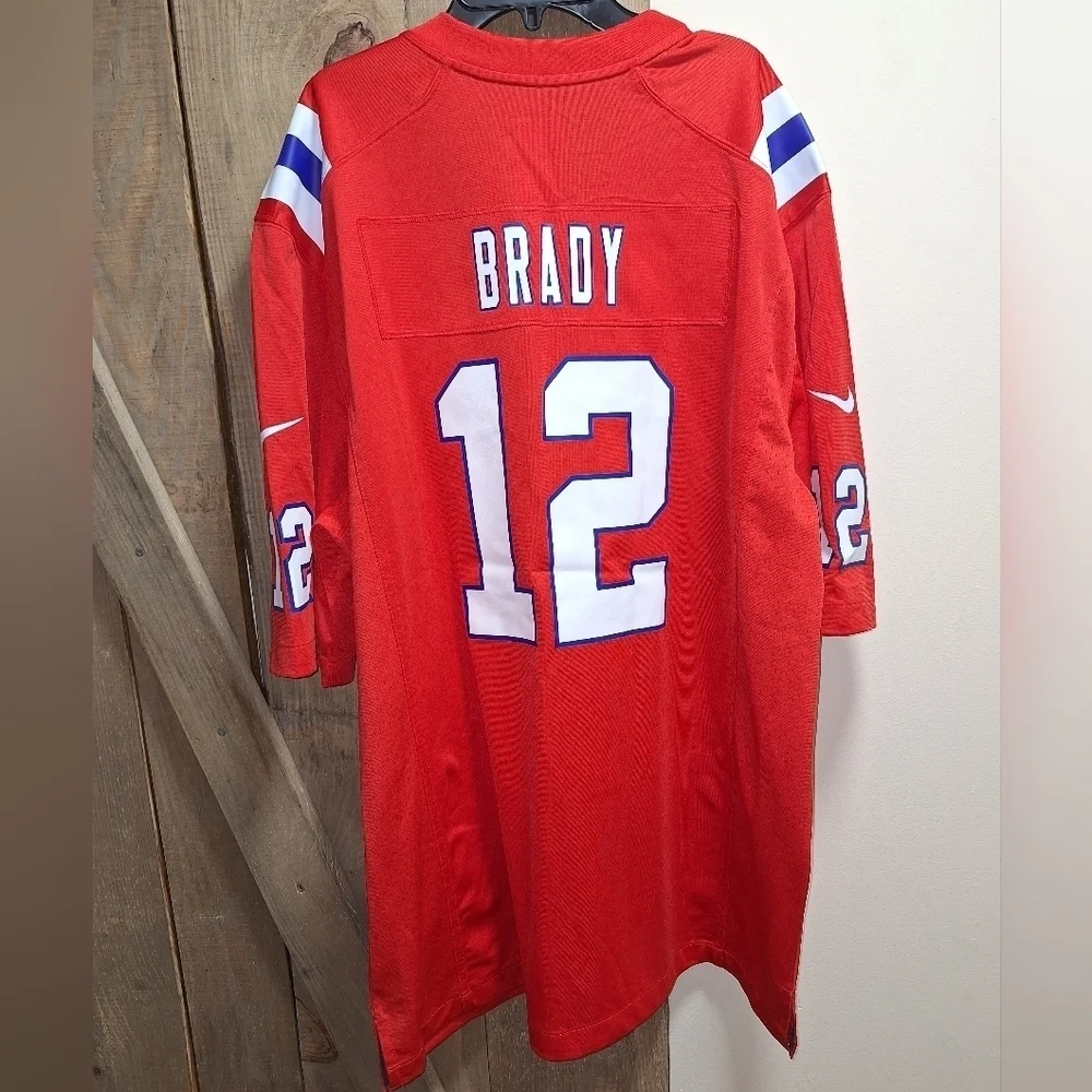 A Nike official NFL #12 Brady jersey in a mens XL and medium. NWOT.